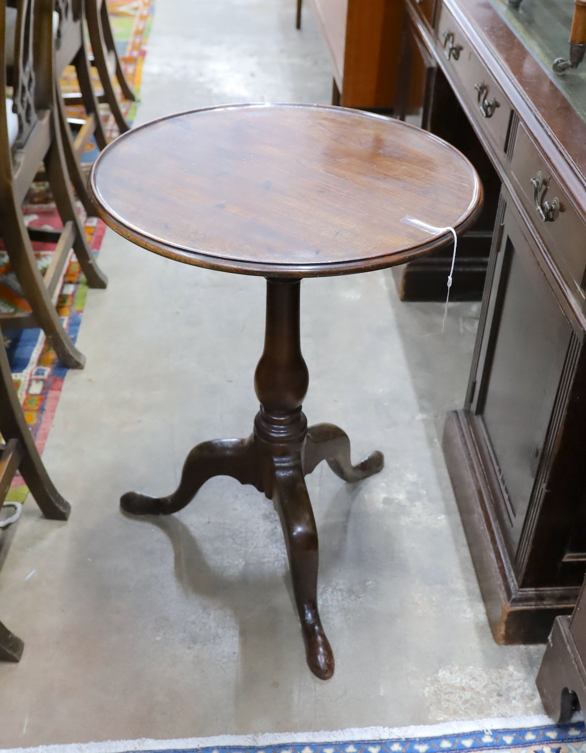 A George III mahogany circular tilt top tripod table, diameter 50cm, height 70cm